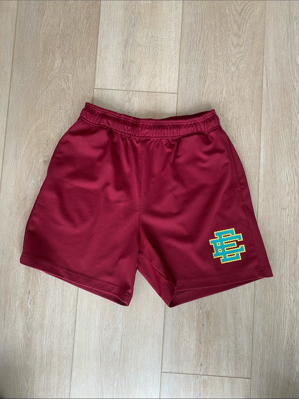 Eric Emanuel Maroon Athletic Shorts with Teal & Yellow Embroidered Logo